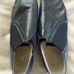 Black jazz shoes with mild wear and tear